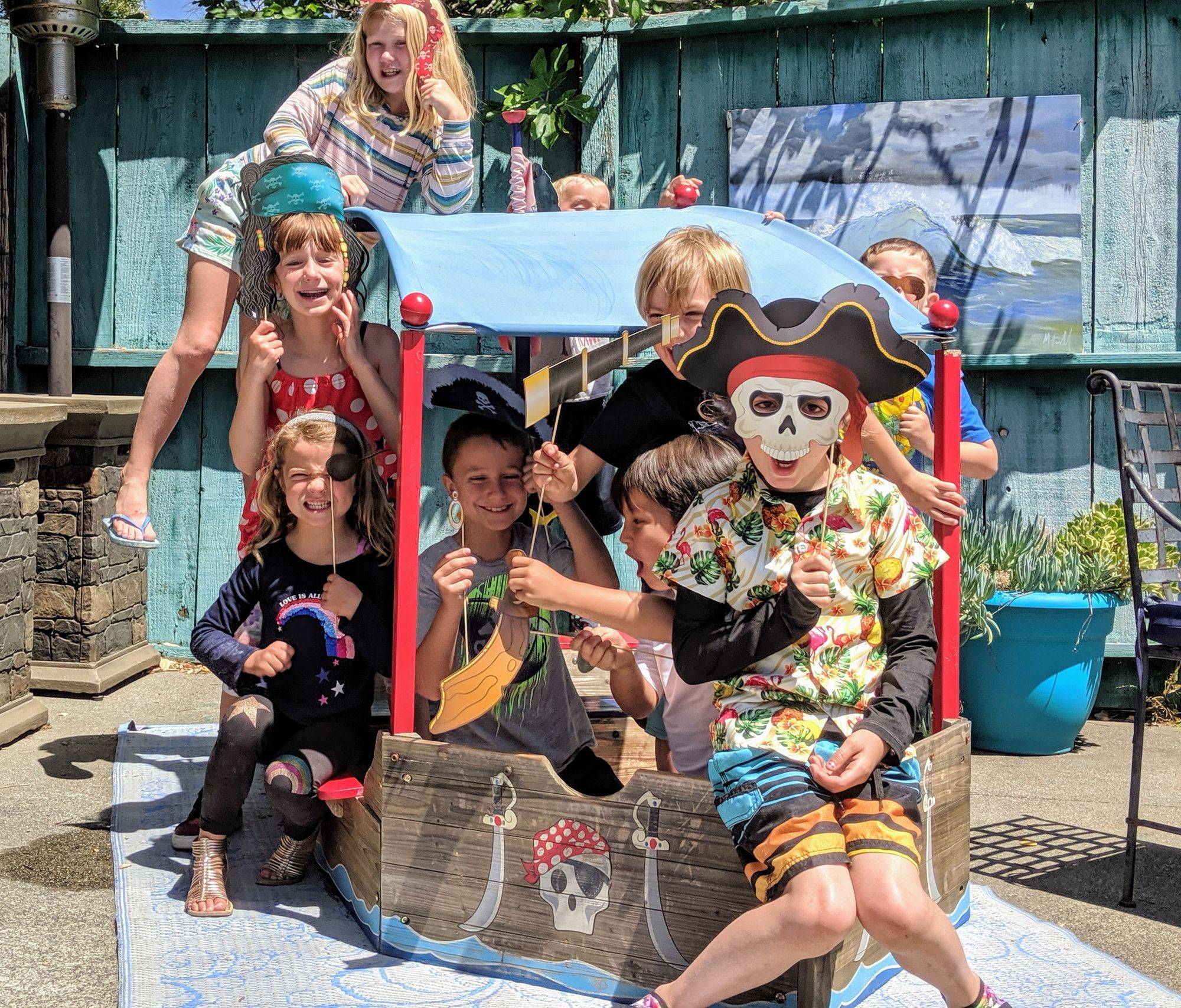Happy summer campers in a pirate ship at Summer Camp at Makai Swim School in Napa, CA